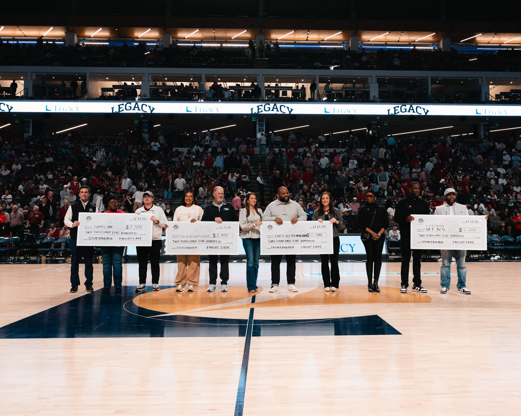 Legacy Builder check presentation at halftime